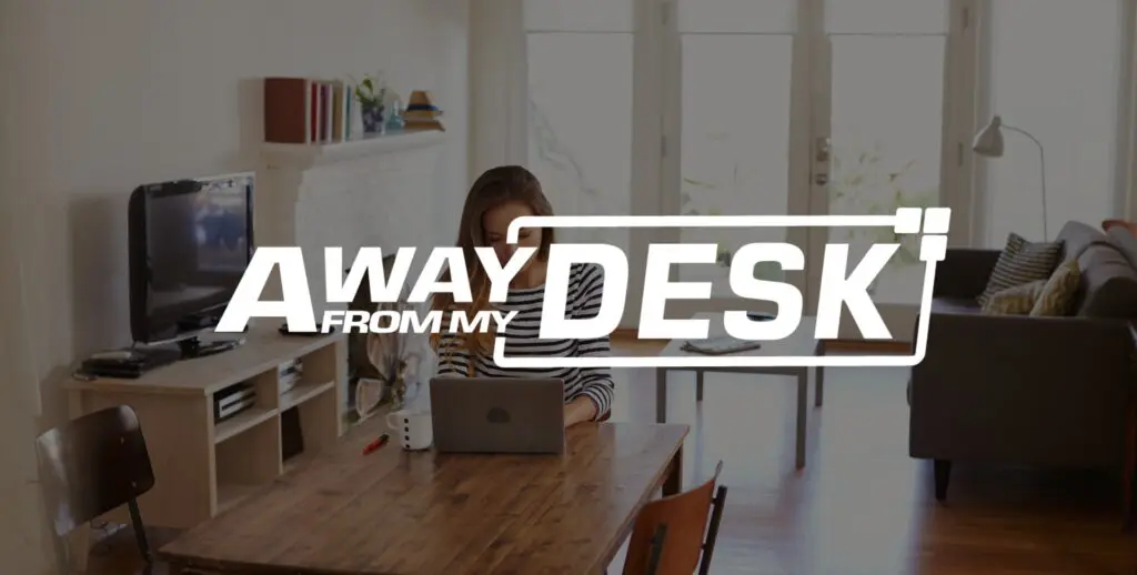 Woman working at her table with the away from my desk logo on top of it