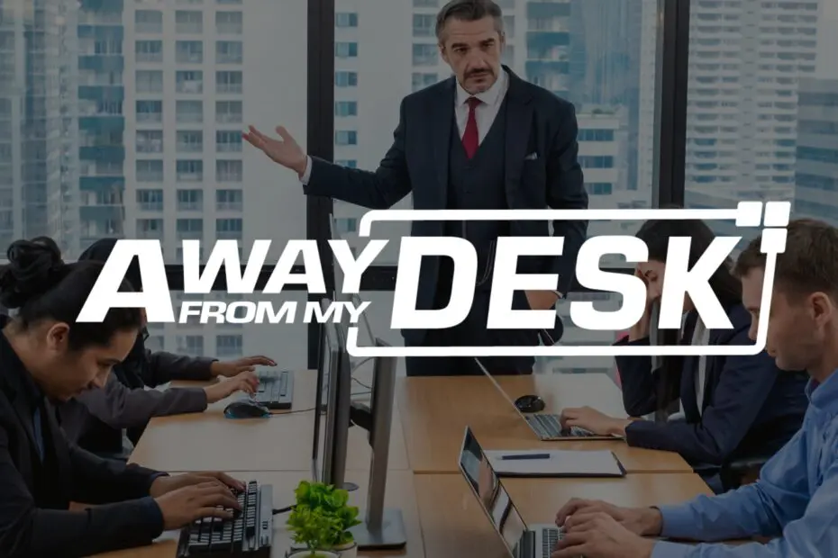 Serious looking businessman wearing a suit holding a meeting with the away from my desk logo on top of it