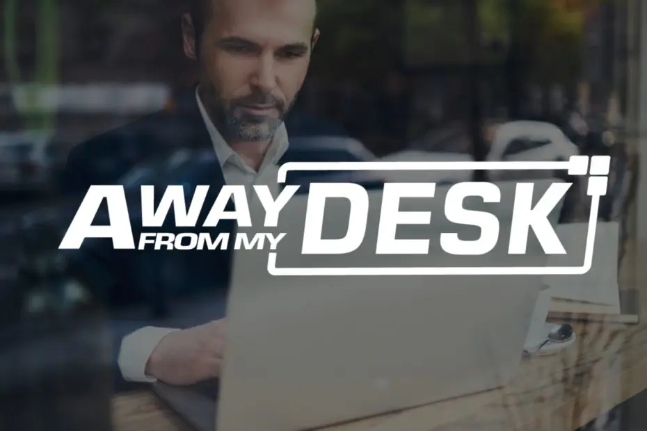 man in a suit looking at his computer with the Away From My Desk logo on top of it