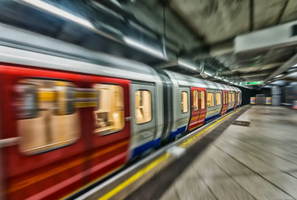 Fast moving subway train in London underground station