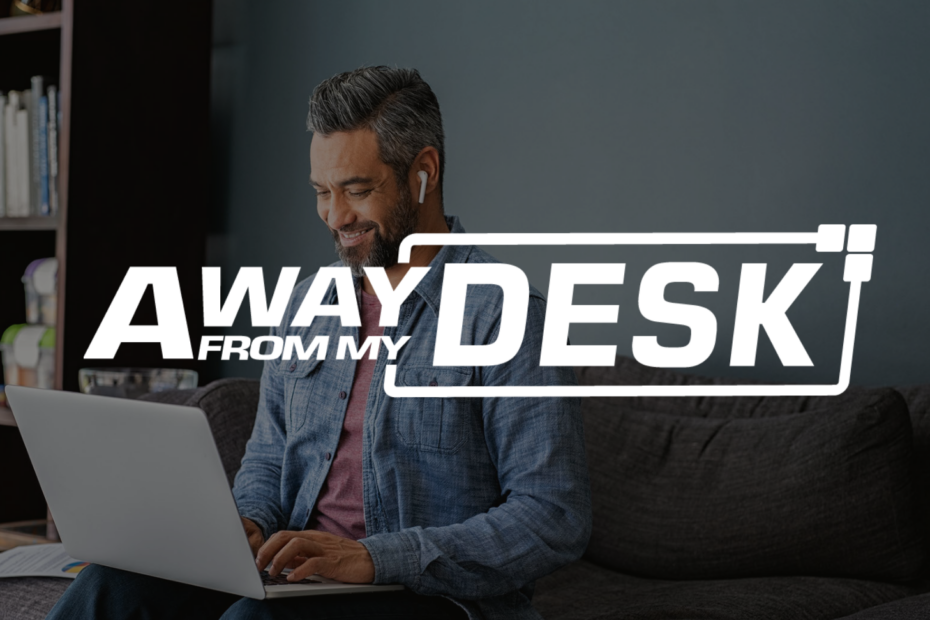 AwayFromMyDesk white logo on a background with a smiling man sat on a sofa at home, whilst working on his laptop