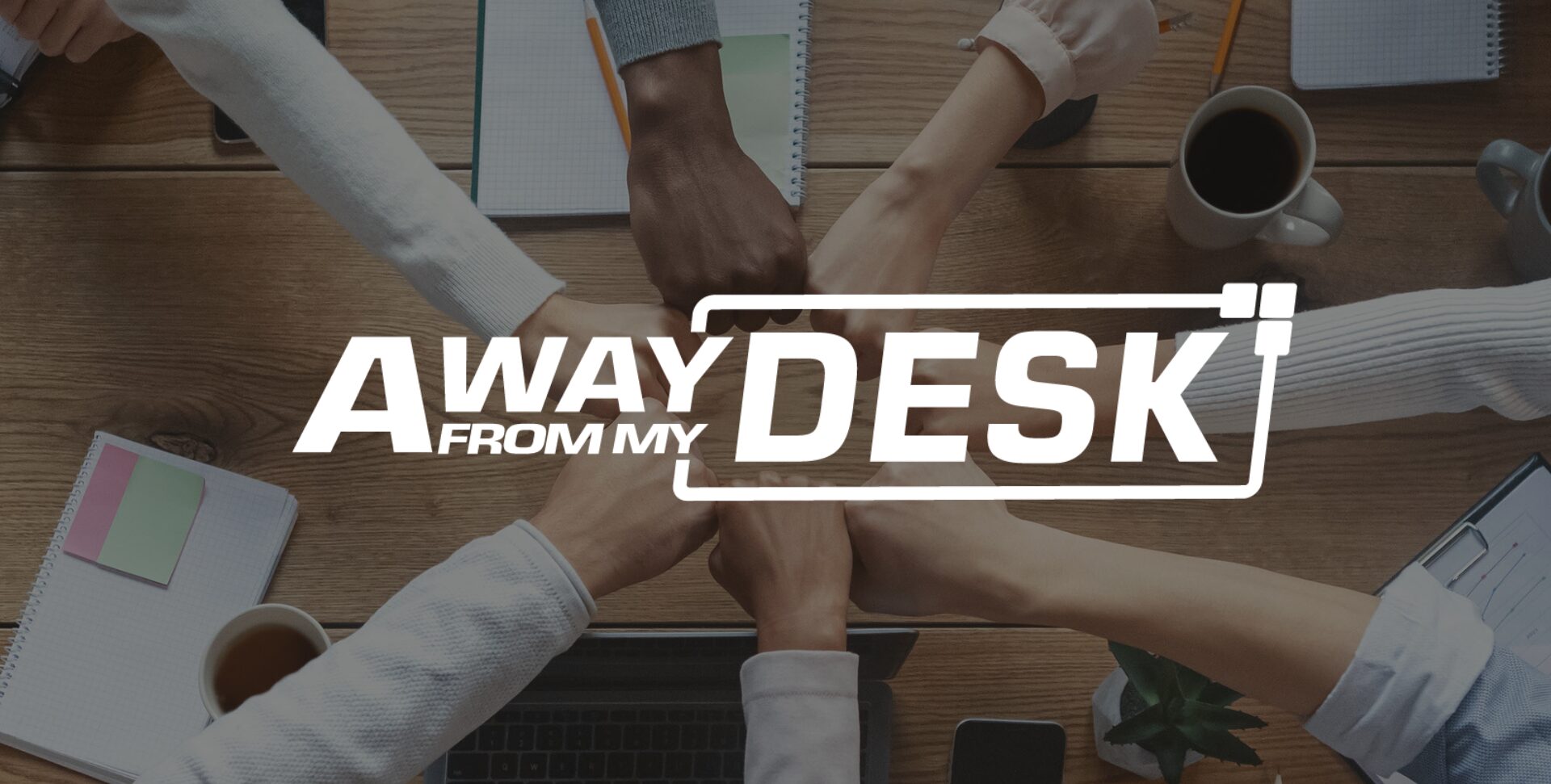 AwayFromMyDesk white logo on a background with a group of people joining fists to show teamwork