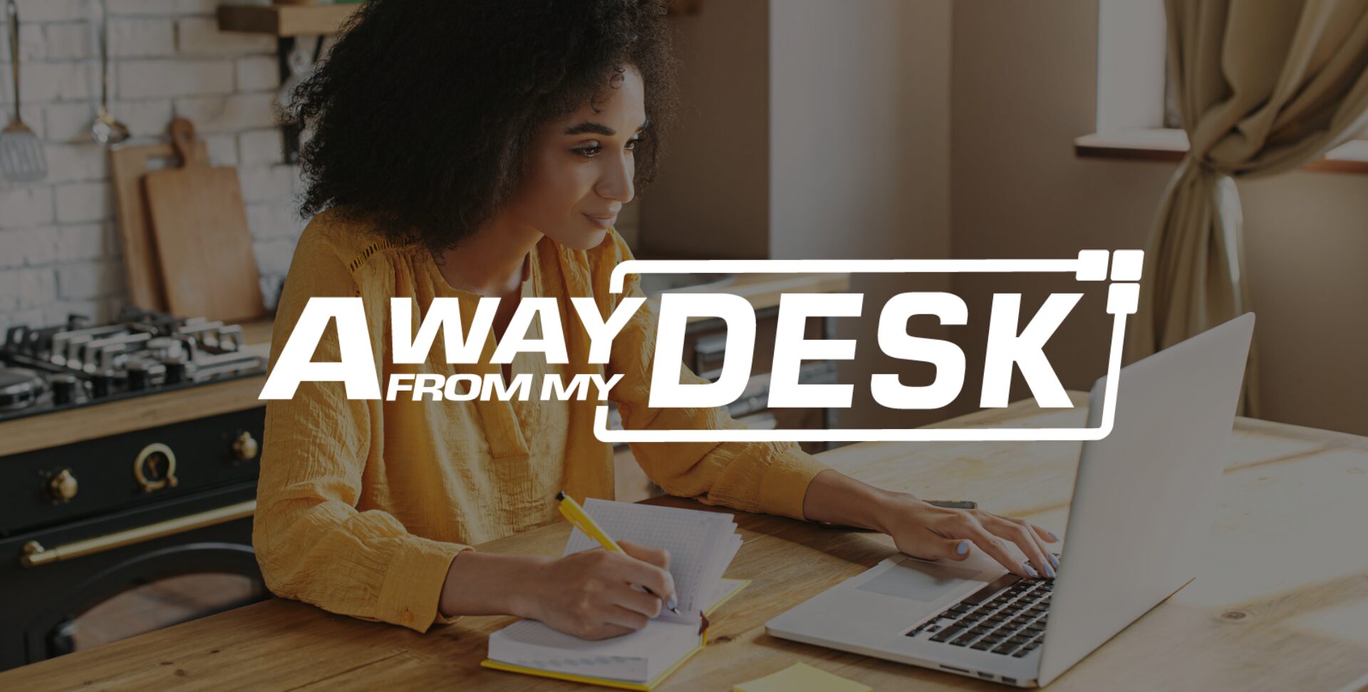 A woman smiling at her laptop screen with the Away From My Desk logo on top of it