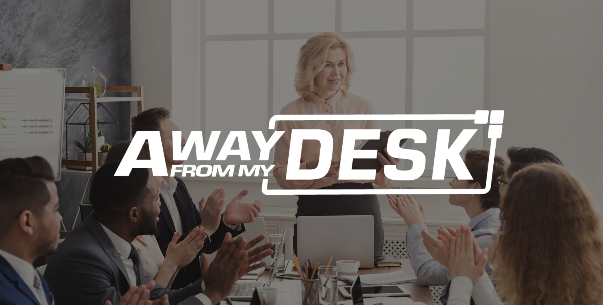 Woman being praised by several member of staff within a meeting with the away from my desk logo on top of it