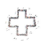 Large group of people stood up together to form the silhouette of a NHS cross, on a white background