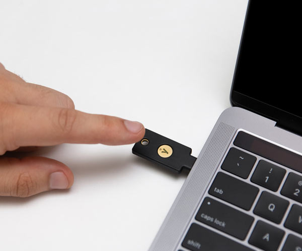 YubiKey 5c nfc token inserted into a Mac laptop