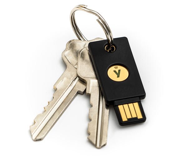 YubiKey 5nfc-key on a keyring with 2 keys with a white background
